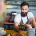 customer making payment through payment terminal counter